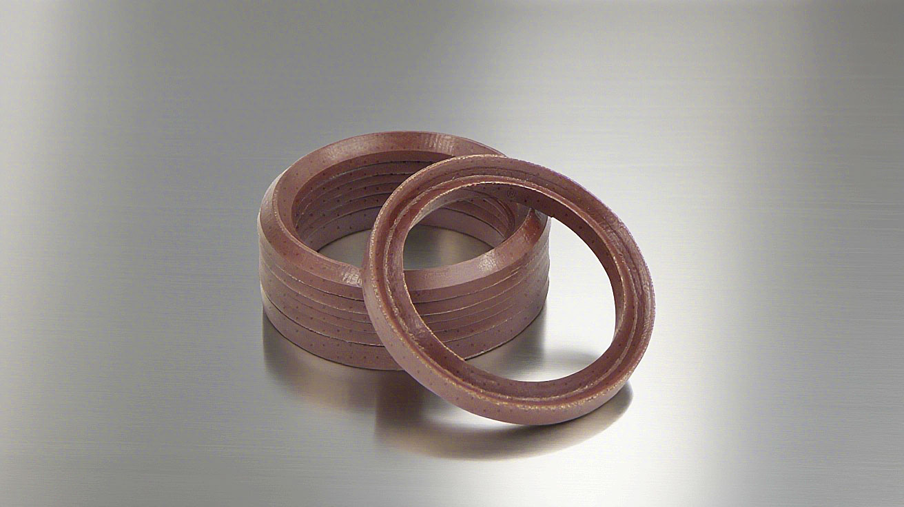 氟橡膠V型夾布油封---是由氟橡膠（FKM）+夾布密封材料制成的油封，主要應用于盾構機、冶金設備、陶瓷設備、重載油缸、油壓機等